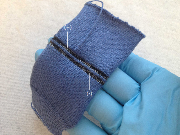 Knitted clothing to store energy for smart devices